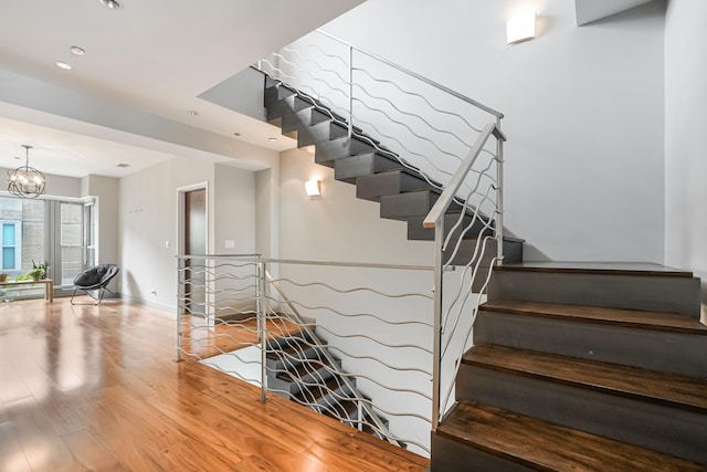 33 W Ontario St Unit Th5, Chicago, IL 60654 - staircase with wood finished floors, recessed lighting, and a chandelier