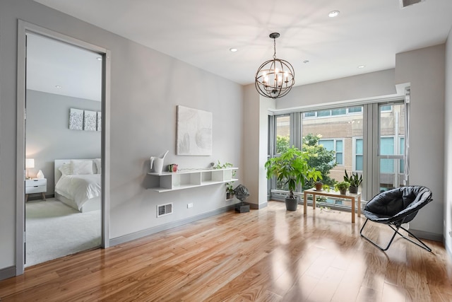 33 W Ontario St Unit Th5, Chicago, IL 60654 - sitting room featuring wood finished floors, a chandelier, and recessed lighting