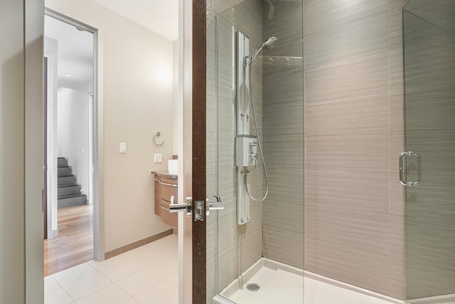 33 W Ontario St Unit Th5, Chicago, IL 60654 - full bath featuring tile patterned floors, a stall shower, and vanity