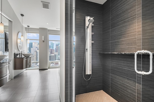 33 W Ontario St Unit Th5, Chicago, IL 60654 - bathroom featuring a shower stall, vanity, and a city view