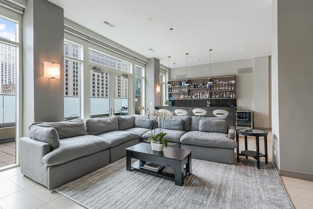 33 W Ontario St Unit Th5, Chicago, IL 60654 - living room with light tile patterned floors and a dry bar