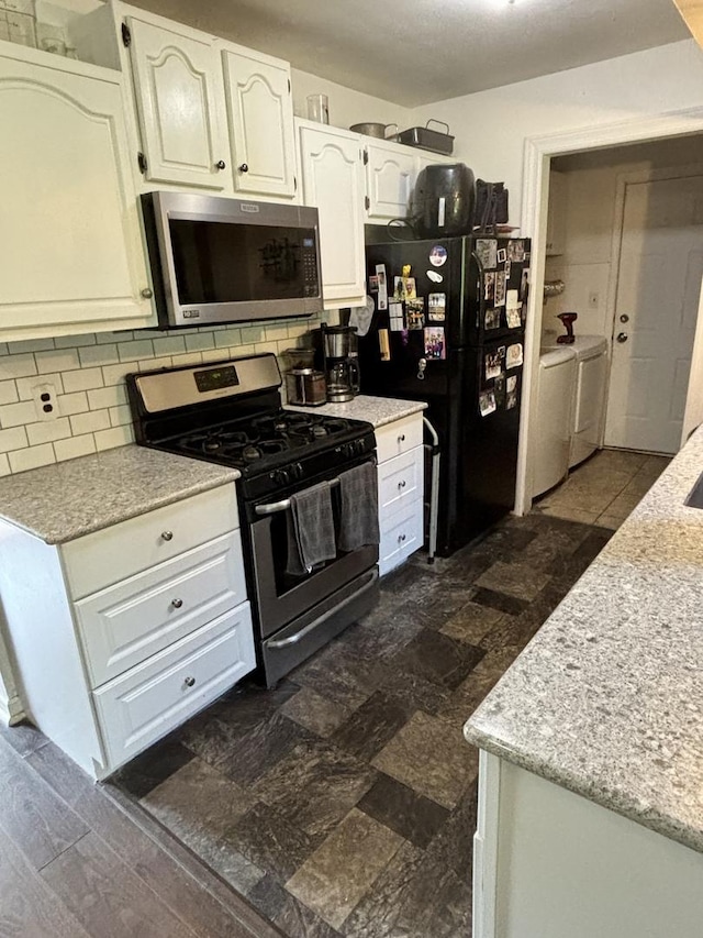 847 Teverton Ln, Crystal Lake, IL 60014 - kitchen featuring stainless steel appliances, washing machine and clothes dryer, backsplash, and white cabinets