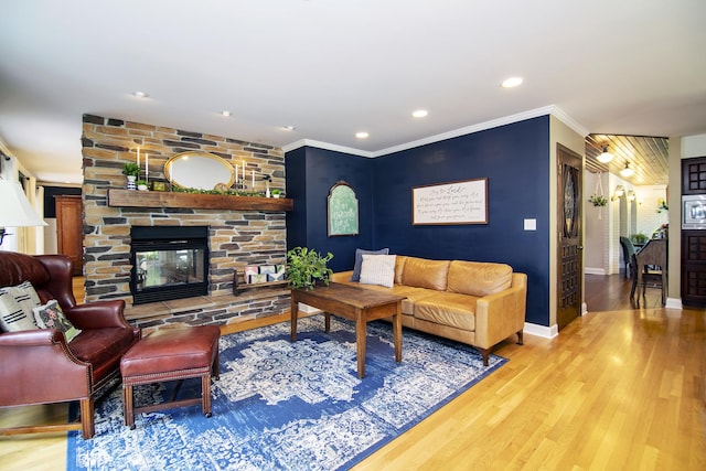 1444 Guildford Dr, Bourbonnais, IL 60914 - living area featuring ornamental molding, wood finished floors, a stone fireplace, and recessed lighting