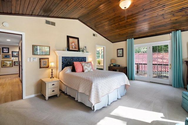 1444 Guildford Dr, Bourbonnais, IL 60914 - bedroom with access to exterior, wooden ceiling, vaulted ceiling, light colored carpet, and a premium fireplace