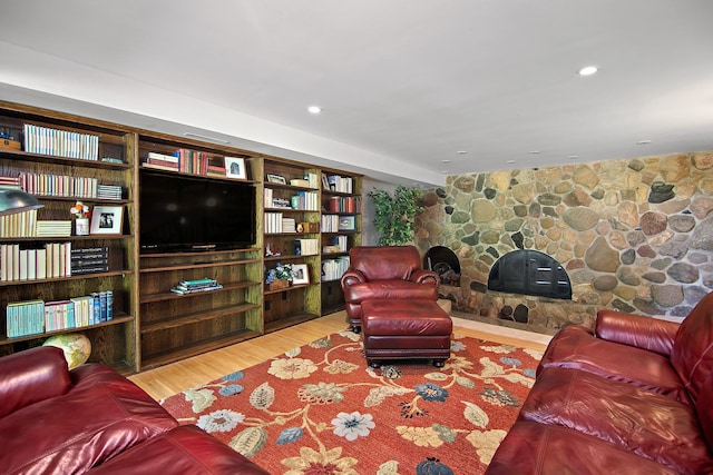 1444 Guildford Dr, Bourbonnais, IL 60914 - living area featuring wood finished floors, a stone fireplace, and recessed lighting
