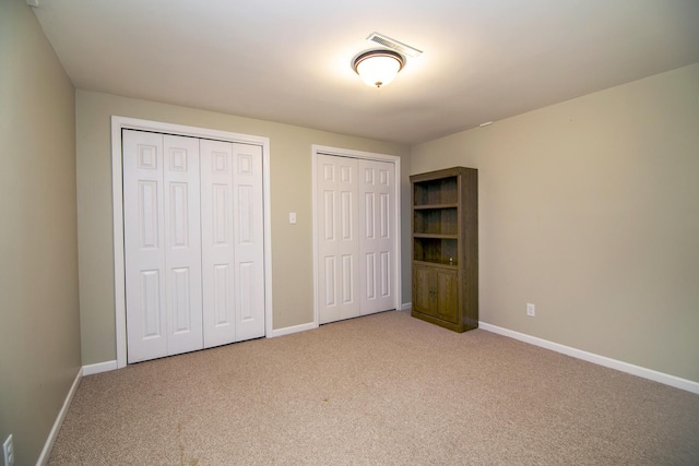1444 Guildford Dr, Bourbonnais, IL 60914 - unfurnished bedroom with two closets and carpet