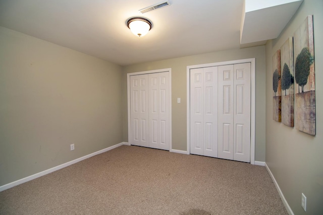 1444 Guildford Dr, Bourbonnais, IL 60914 - unfurnished bedroom featuring two closets and carpet flooring