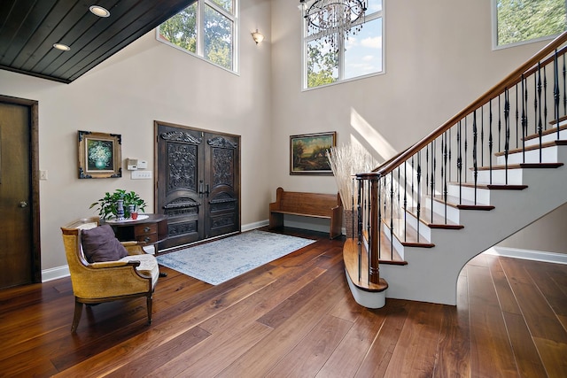 1444 Guildford Dr, Bourbonnais, IL 60914 - entrance foyer with stairway, plenty of natural light, a chandelier, hardwood / wood-style flooring, and a towering ceiling