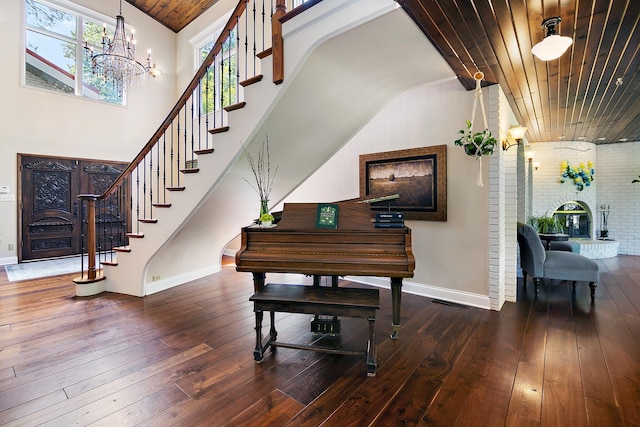 1444 Guildford Dr, Bourbonnais, IL 60914 - staircase featuring hardwood / wood-style floors, lofted ceiling, a chandelier, and wood ceiling