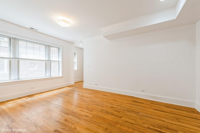 5412 N Kenmore Ave Unit 1W, Chicago, IL 60640 - unfurnished room with baseboards and light wood finished floors