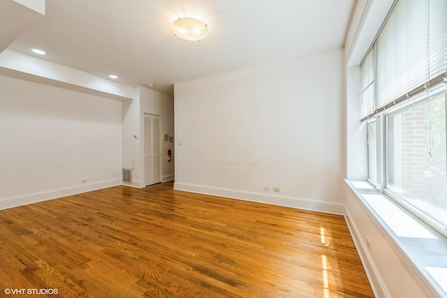 5412 N Kenmore Ave Unit 1W, Chicago, IL 60640 - empty room with light wood-style flooring and recessed lighting