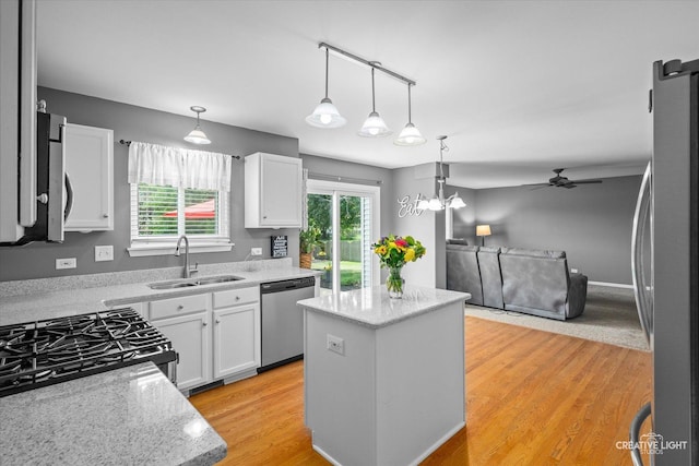 1918 Congrove Dr, Aurora, IL 60504 - kitchen with appliances with stainless steel finishes, a center island, white cabinets, and open floor plan