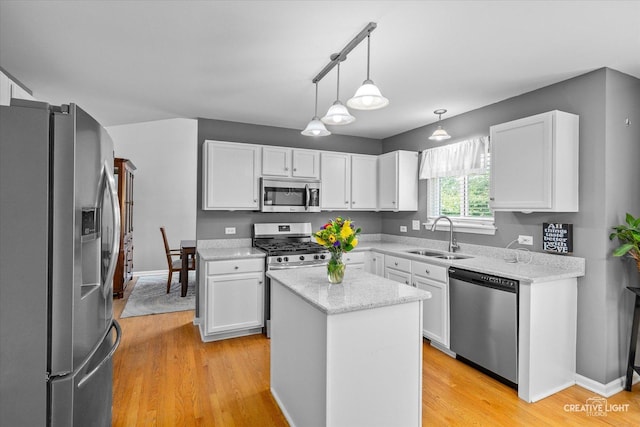 1918 Congrove Dr, Aurora, IL 60504 - kitchen with stainless steel appliances, white cabinets, light wood-style floors, hanging light fixtures, and a center island