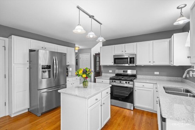 1918 Congrove Dr, Aurora, IL 60504 - kitchen featuring stainless steel appliances, white cabinetry, and light wood-style flooring