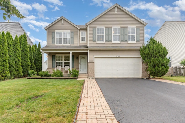 1704 Cascade Ridge Dr, Plainfield, IL 60586 - traditional-style house with asphalt driveway, an attached garage, a porch, and brick siding