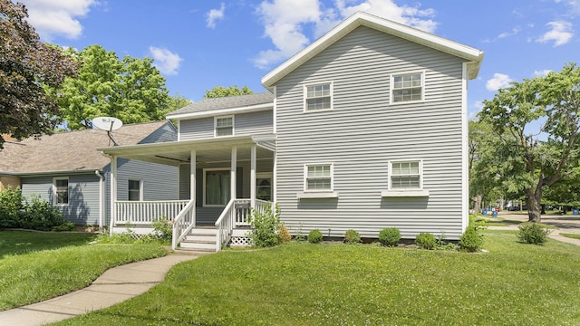 502 N Dixon Ave, Dixon, IL 61021 - traditional-style house featuring covered porch, a front yard, and roof with shingles