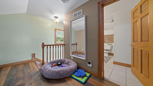 502 N Dixon Ave, Dixon, IL 61021 - hall with an upstairs landing, vaulted ceiling, and light wood finished floors
