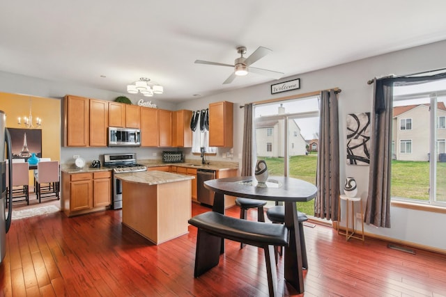 6500 Pasture Side Trl, Matteson, IL 60443 - kitchen with stainless steel appliances, a chandelier, a center island, light countertops, and plenty of natural light