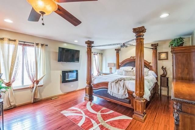 6500 Pasture Side Trl, Matteson, IL 60443 - bedroom featuring a fireplace, hardwood / wood-style flooring, recessed lighting, ornate columns, and ceiling fan