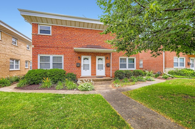 437 S Elmhurst Rd, Mount Prospect, IL 60056 - view of front of property featuring a front yard and brick siding