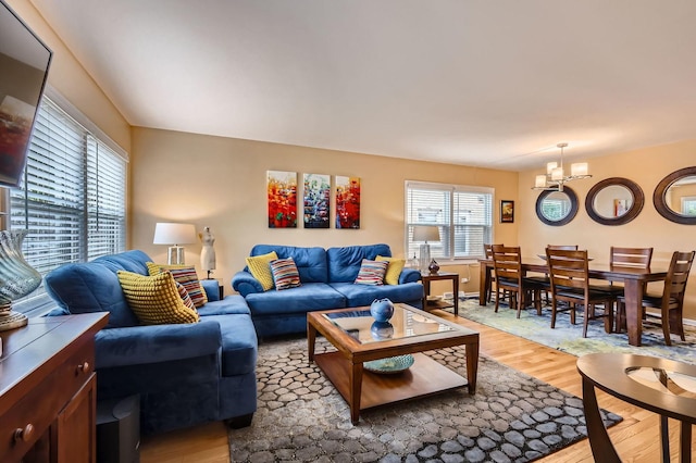 437 S Elmhurst Rd, Mount Prospect, IL 60056 - living area featuring light wood finished floors and a chandelier