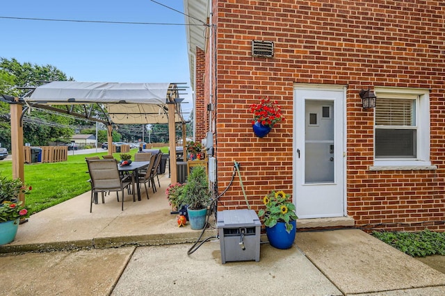 437 S Elmhurst Rd, Mount Prospect, IL 60056 - entrance to property featuring brick siding, a lawn, a patio area, and outdoor dining space