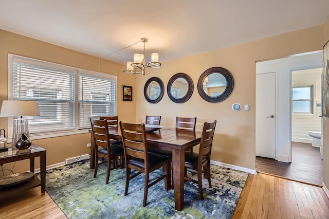 437 S Elmhurst Rd, Mount Prospect, IL 60056 - dining room featuring a chandelier, plenty of natural light, and hardwood / wood-style flooring