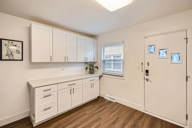 437 S Elmhurst Rd, Mount Prospect, IL 60056 - foyer featuring baseboards and dark wood-style floors