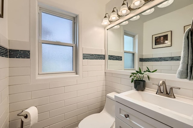 437 S Elmhurst Rd, Mount Prospect, IL 60056 - half bathroom with tile walls, vanity, and wainscoting