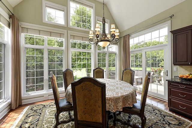 26285 W Roberts Ln, Barrington, IL 60010 - dining room featuring a chandelier, high vaulted ceiling, and light wood-style flooring