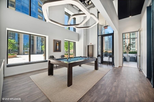 450 E Waterside Dr Unit 1606, Chicago, IL 60601 - rec room featuring a towering ceiling, billiards, and wood finished floors