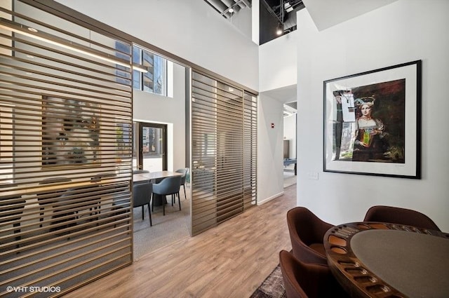 450 E Waterside Dr Unit 1606, Chicago, IL 60601 - living area with light wood-type flooring and a high ceiling