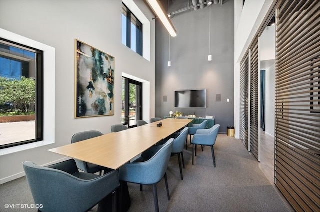 450 E Waterside Dr Unit 1606, Chicago, IL 60601 - carpeted dining space with a towering ceiling and baseboards
