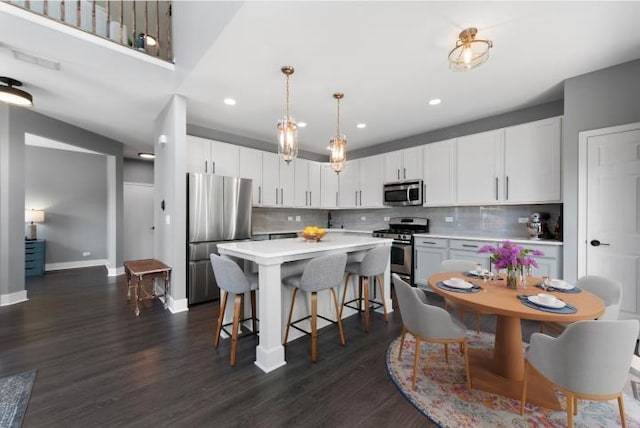 561 S Jade Ln Unit 1106, Round Lake, IL 60073 - kitchen with stainless steel appliances, a kitchen bar, light countertops, backsplash, and recessed lighting