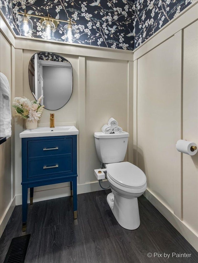 561 S Jade Ln Unit 1106, Round Lake, IL 60073 - bathroom featuring wood finished floors, vanity, and a decorative wall