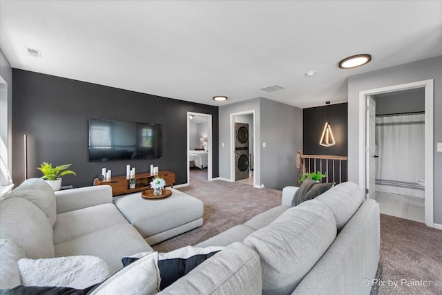 561 S Jade Ln Unit 1106, Round Lake, IL 60073 - living room with stacked washing machine and dryer and carpet