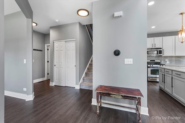 561 S Jade Ln Unit 1106, Round Lake, IL 60073 - hall featuring dark wood-type flooring, stairs, and recessed lighting