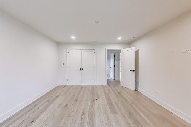 5830 Brookbank Rd, Downers Grove, IL 60516 - unfurnished bedroom with light wood-style flooring, recessed lighting, and a closet
