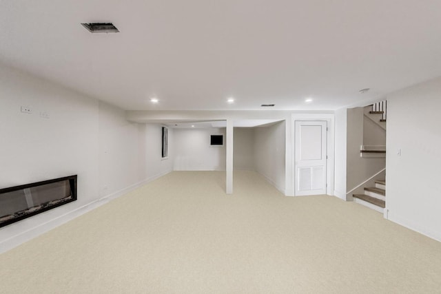 5830 Brookbank Rd, Downers Grove, IL 60516 - finished below grade area with stairs, recessed lighting, light colored carpet, and a glass covered fireplace