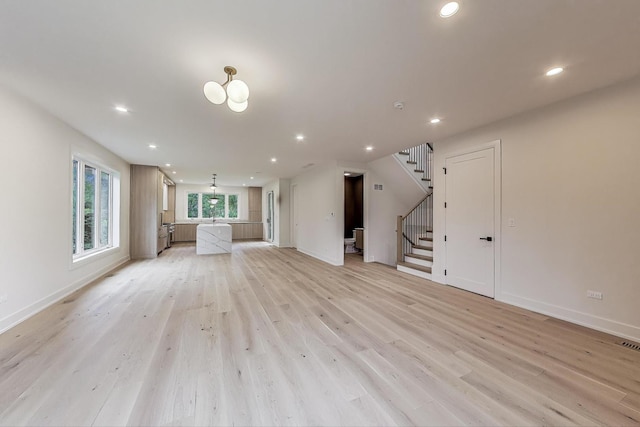 5830 Brookbank Rd, Downers Grove, IL 60516 - unfurnished living room featuring recessed lighting, stairs, and light wood-style flooring