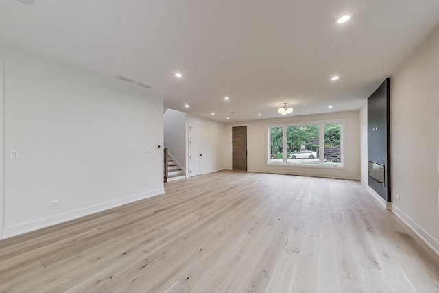5830 Brookbank Rd, Downers Grove, IL 60516 - unfurnished living room with stairway, light wood-style flooring, and recessed lighting