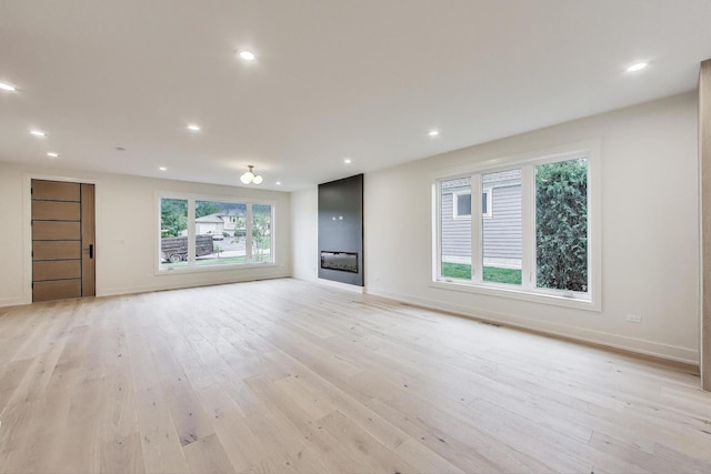 5830 Brookbank Rd, Downers Grove, IL 60516 - unfurnished living room with light wood finished floors and recessed lighting