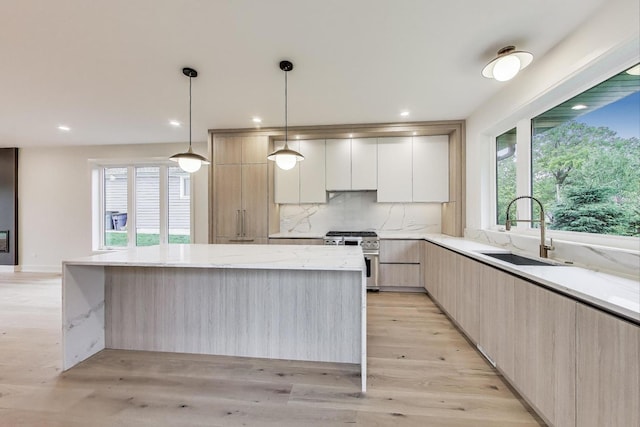 5830 Brookbank Rd, Downers Grove, IL 60516 - kitchen with stainless steel stove, modern cabinets, healthy amount of natural light, and recessed lighting