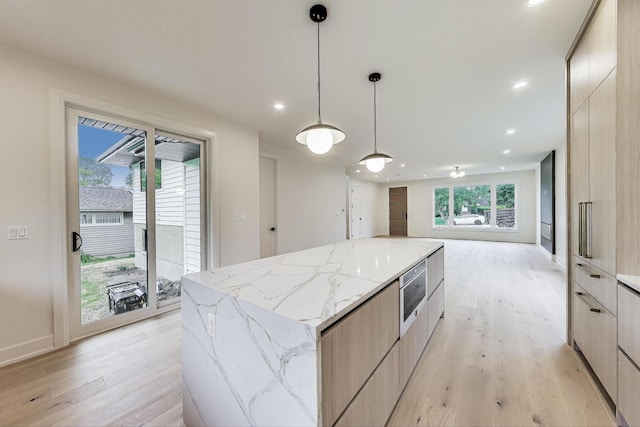 5830 Brookbank Rd, Downers Grove, IL 60516 - kitchen featuring modern cabinets, stainless steel microwave, a large island, light wood finished floors, and recessed lighting