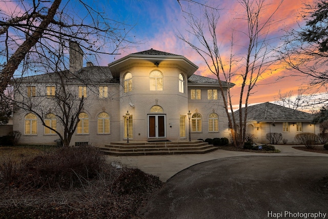 74 Dundee Ln, Barrington Hills, IL 60010 - mediterranean / spanish house featuring a chimney