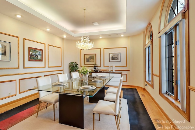 74 Dundee Ln, Barrington Hills, IL 60010 - dining area with a chandelier, a tray ceiling, and recessed lighting