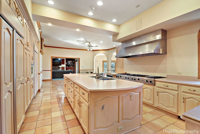 74 Dundee Ln, Barrington Hills, IL 60010 - kitchen with wall chimney range hood, light tile patterned floors, stainless steel gas stovetop, light countertops, and ornamental molding
