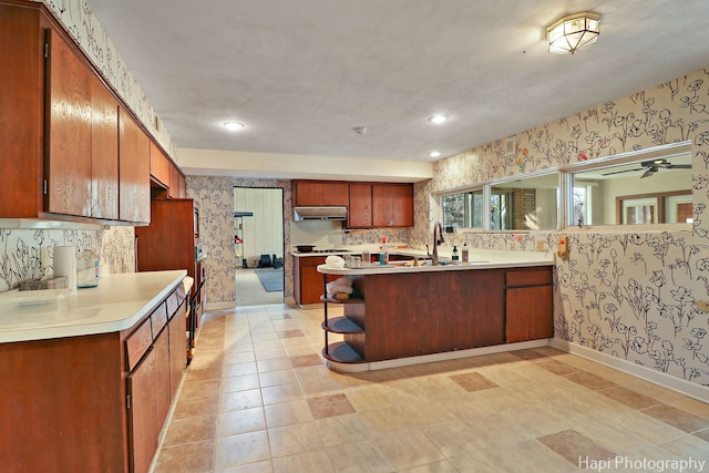 74 Dundee Ln, Barrington Hills, IL 60010 - kitchen featuring wallpapered walls, a peninsula, light countertops, open shelves, and recessed lighting