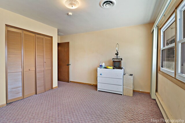 74 Dundee Ln, Barrington Hills, IL 60010 - carpeted bedroom featuring a baseboard heating unit and a closet