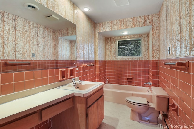 74 Dundee Ln, Barrington Hills, IL 60010 - full bath featuring wallpapered walls, tile walls, a garden tub, vanity, and a wainscoted wall